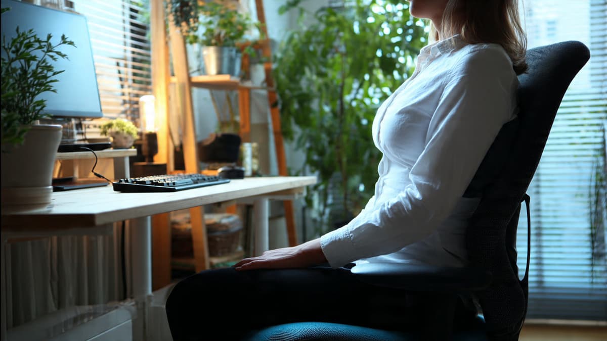 Proper sitting desk ergonomics with lumbar support