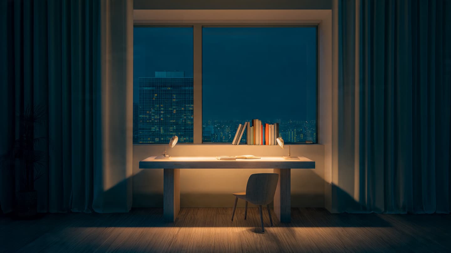White minimalist desk setup at night with soft ambient lighting